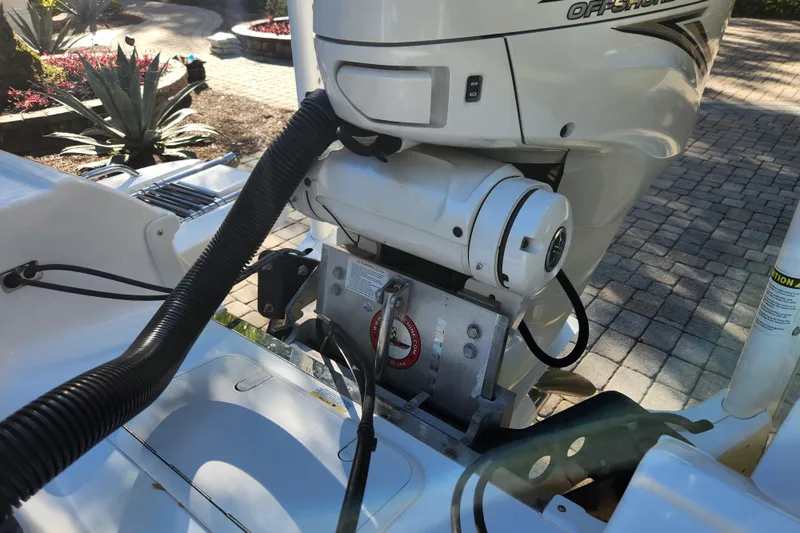  Yacht Photos Pics 2020 Caymas 28 HB boat engine detail with outdoor background.