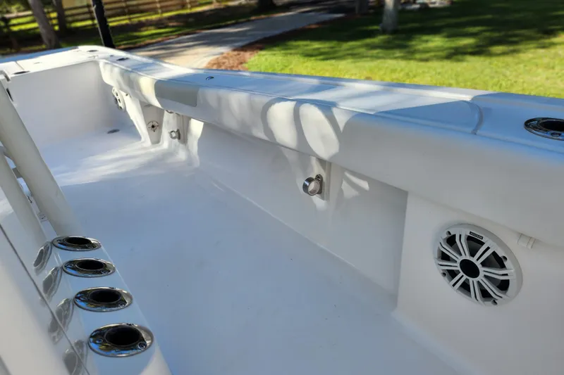  Yacht Photos Pics 2020 Caymas 28 HB boat interior with rod holders and speaker, showcasing sleek design.