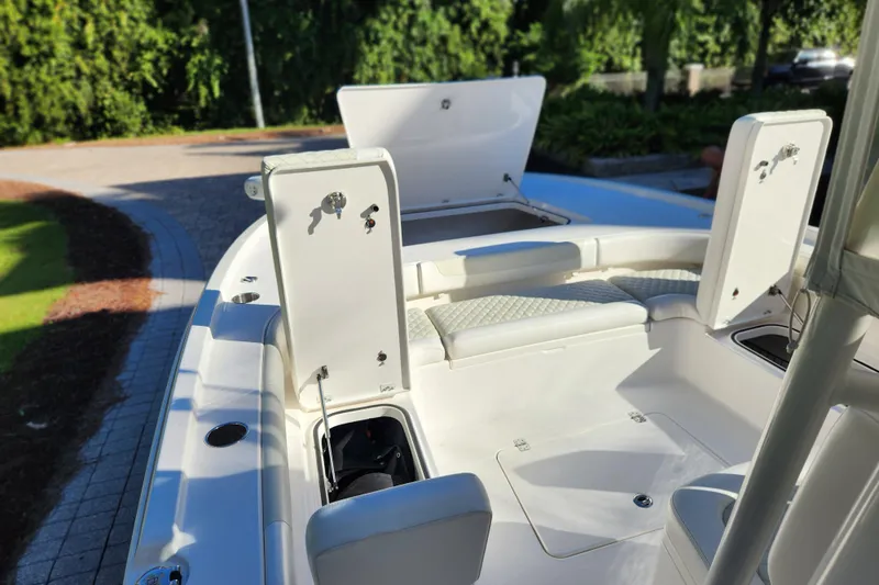  Yacht Photos Pics 2020 Caymas 28 HB boat interior with open storage compartments and seating.