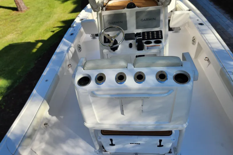  Yacht Photos Pics 2020 Caymas 28 HB boat interior with Garmin navigation system and rod holders.