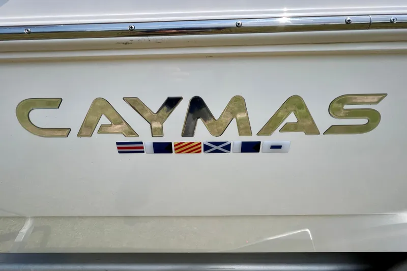  Yacht Photos Pics 2020 Caymas 28 HB boat logo with nautical flags on white background.