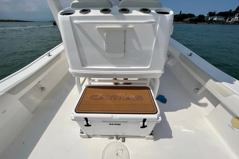  Yacht Photos Pics 2020 Caymas 28 HB boat interior with branded seating and ocean backdrop.