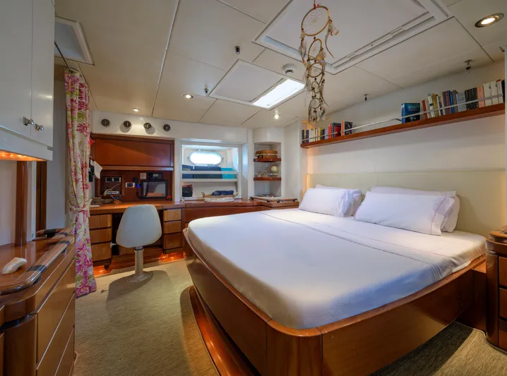 Billy Budd II Yacht Photos Pics Luxurious cabin interior of 1994 Royal Huisman 112' Custom yacht with elegant wood furnishings.