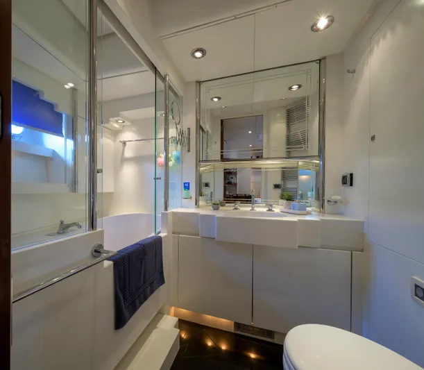 Billy Budd II Yacht Photos Pics Luxurious bathroom in 1994 Royal Huisman 112' Custom yacht, featuring modern fixtures and elegant design.