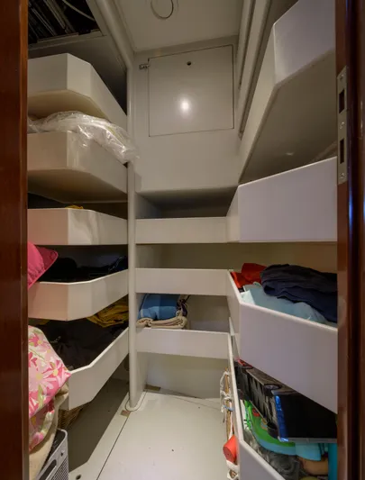 Billy Budd II Yacht Photos Pics Storage area with shelves on a 1994 Royal Huisman 112' Custom yacht.