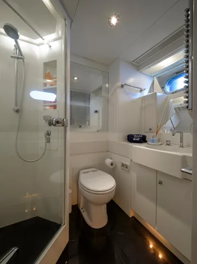 Billy Budd II Yacht Photos Pics Luxurious bathroom on 1994 Royal Huisman 112' Custom yacht with modern shower and sleek fixtures.