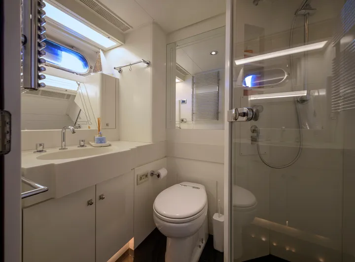 Billy Budd II Yacht Photos Pics Luxurious bathroom in 1994 Royal Huisman 112' Custom yacht, featuring modern fixtures and shower.