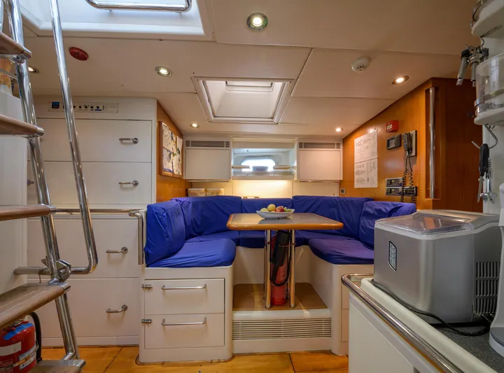 Billy Budd II Yacht Photos Pics Luxurious interior of 1994 Royal Huisman 112' Custom yacht with cozy seating and modern amenities.