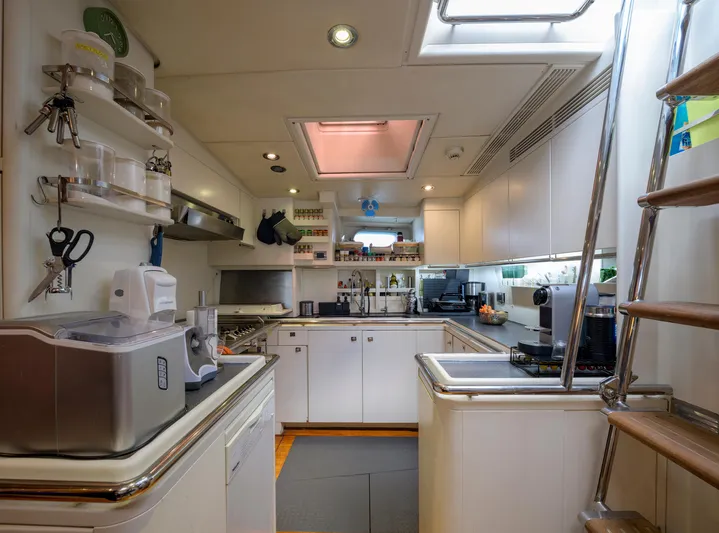 Billy Budd II Yacht Photos Pics Luxurious yacht kitchen interior on 1994 Royal Huisman 112' Custom, featuring modern appliances and sleek design.