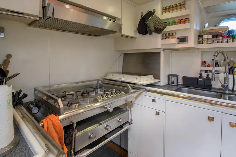 Billy Budd II Yacht Photos Pics Galley kitchen in 1994 Royal Huisman 112' Custom yacht with modern appliances and storage.