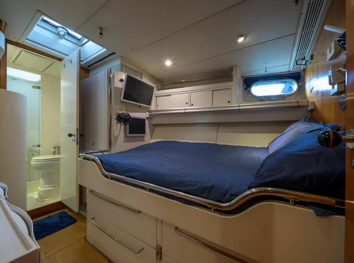 Billy Budd II Yacht Photos Pics Luxurious cabin interior of 1994 Royal Huisman 112' Custom yacht with bed and ensuite bathroom.