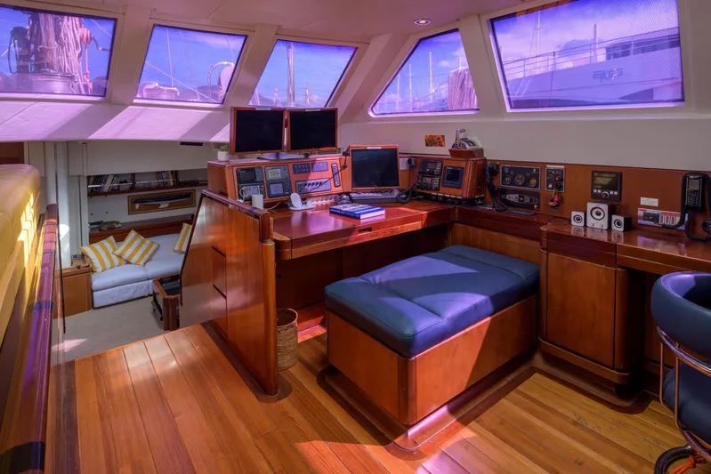 Billy Budd II Yacht Photos Pics Luxurious interior of 1994 Royal Huisman 112' Custom yacht with navigation equipment and seating.