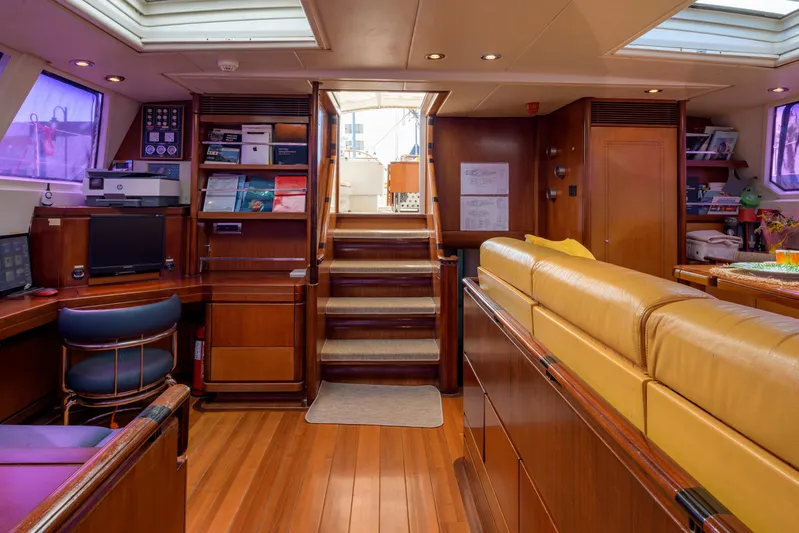 Billy Budd II Yacht Photos Pics Luxurious interior of 1994 Royal Huisman 112' Custom yacht with wood finishes and modern amenities.