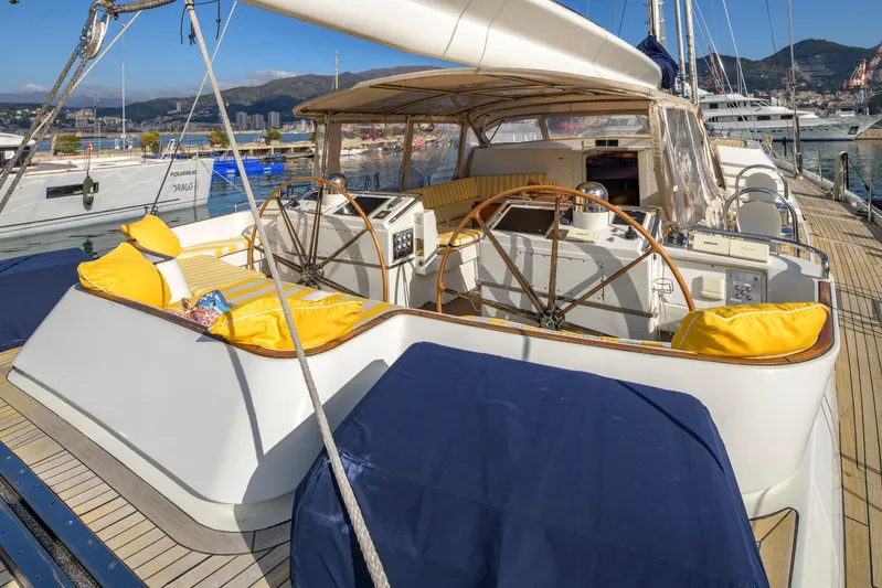 Billy Budd II Yacht Photos Pics Luxurious 1994 Royal Huisman 112' Custom yacht with spacious deck and vibrant yellow cushions.
