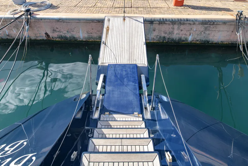 Billy Budd II Yacht Photos Pics Royal Huisman 112' Custom yacht, 1994, docked with gangway leading to pier.
