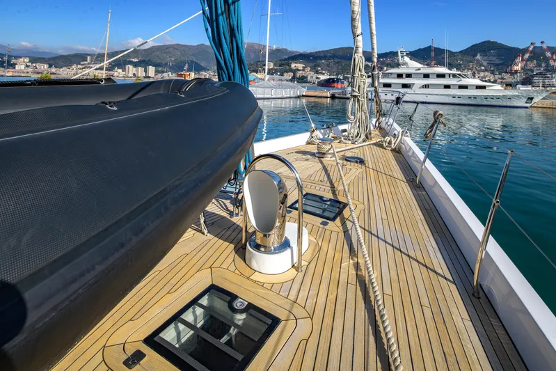 Billy Budd II Yacht Photos Pics Deck view of 1994 Royal Huisman 112' Custom yacht in marina, showcasing sleek design and craftsmanship.