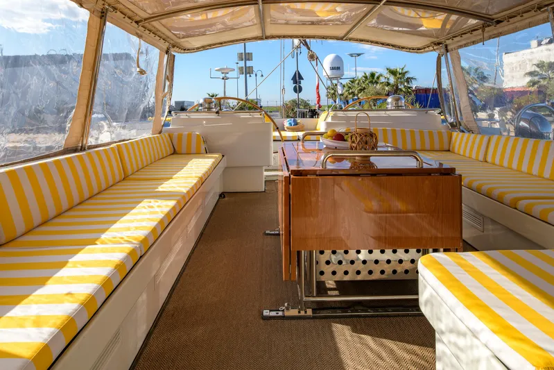 Billy Budd II Yacht Photos Pics Luxurious Royal Huisman 112' Custom yacht interior with striped seating, 1994 model.