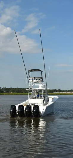  Yacht Photos Pics 2022 Front Runner 39 Center Console boat with four engines on calm water.