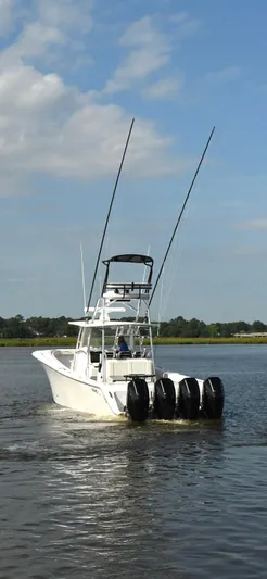  Yacht Photos Pics 2022 Front Runner 39 Center Console boat with four engines on a calm waterway.