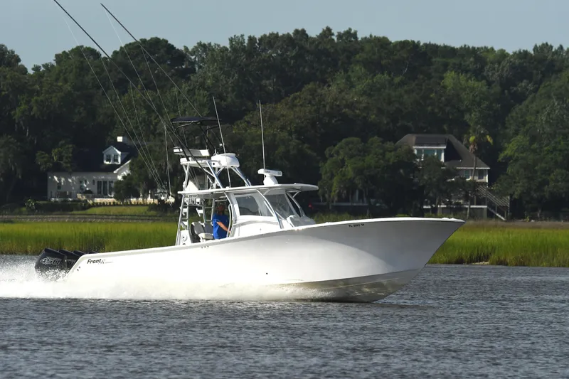  Yacht Photos Pics 2022 Front Runner 39 Center Console boat cruising on a scenic waterway.