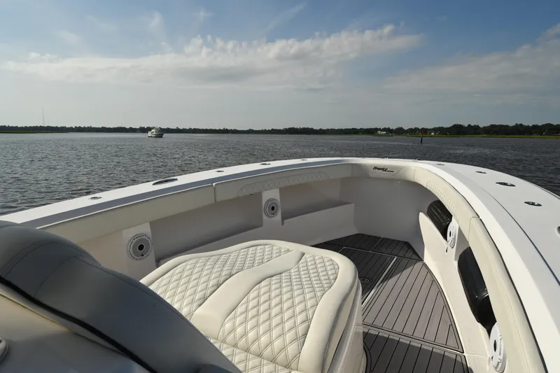  Yacht Photos Pics 2022 Front Runner 39 Center Console boat interior with luxurious seating on calm water.
