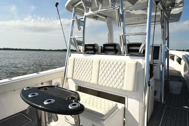  Yacht Photos Pics 2022 Front Runner 39 Center Console boat interior with seating and rod holders on a sunny day.