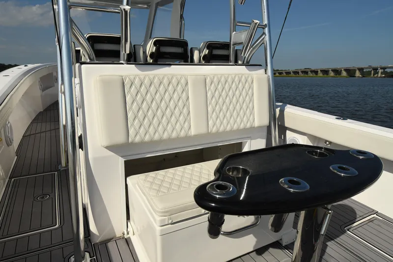  Yacht Photos Pics 2022 Front Runner 39 Center Console boat interior with cushioned seating and rod holders.