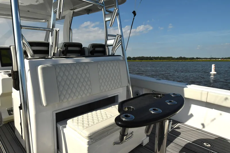  Yacht Photos Pics 2022 Front Runner 39 Center Console boat interior with seating and rod holders on a sunny day.
