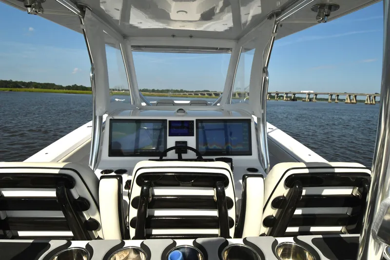  Yacht Photos Pics 2022 Front Runner 39 Center Console boat interior with advanced navigation screens on a sunny day.