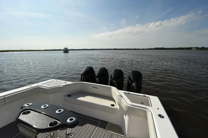  Yacht Photos Pics 2022 Front Runner 39 Center Console boat on calm water, featuring multiple outboard engines.
