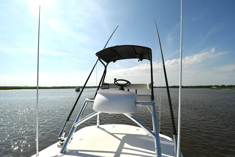  Yacht Photos Pics 2022 Front Runner 39 Center Console boat on calm water under clear blue sky.