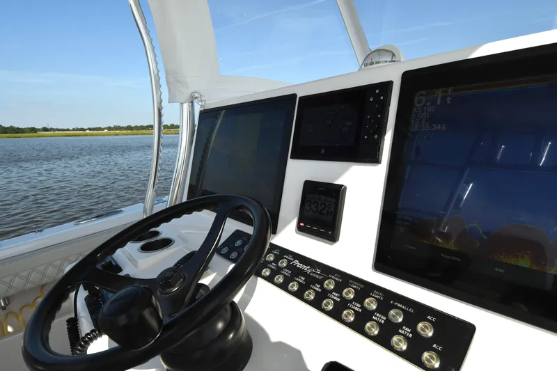  Yacht Photos Pics 2022 Front Runner 39 Center Console helm with advanced navigation displays and steering wheel.