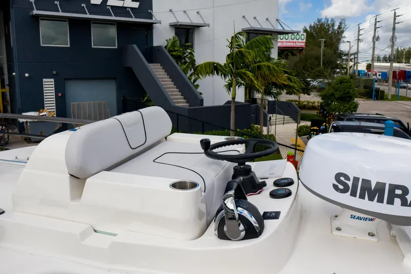 Seavee Yacht Photos Pics 2023 SeaVee 290B boat helm with Simrad electronics and comfortable seating.