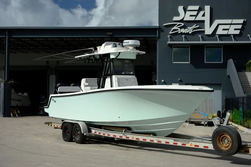 Seavee Yacht Photos Pics 2023 SeaVee 290B boat on trailer outside SeaVee Boats facility.