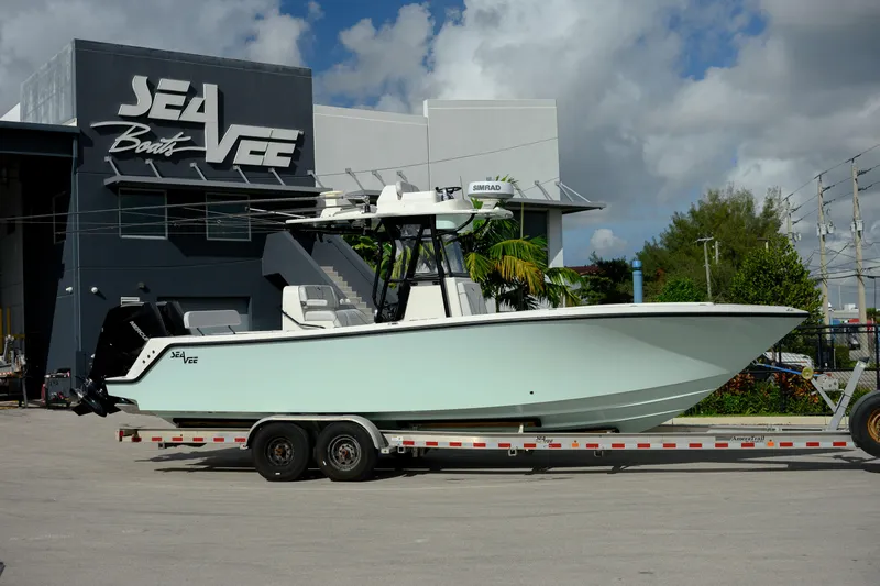 Seavee Yacht Photos Pics 2023 SeaVee 290B boat on trailer outside SeaVee Boats facility.