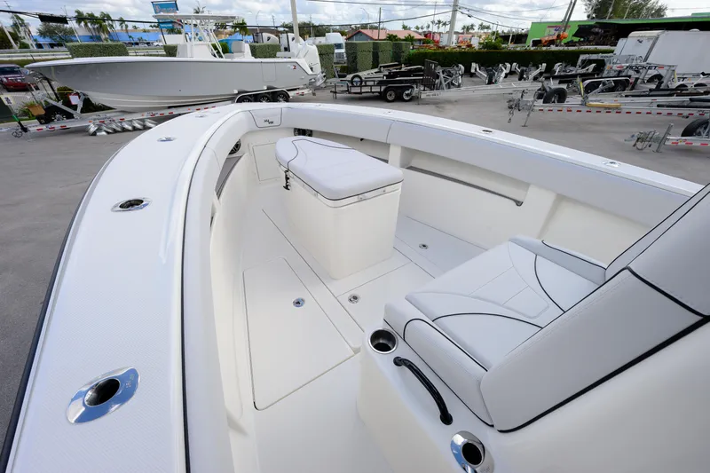 Seavee Yacht Photos Pics 2023 SeaVee 290B boat interior with white seating and sleek design.