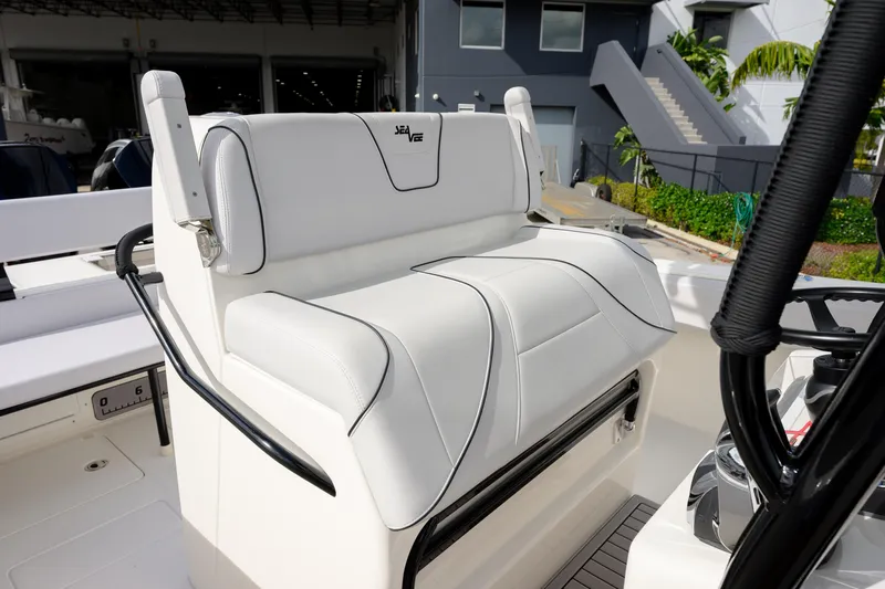 Seavee Yacht Photos Pics 2023 SeaVee 290B boat with white cushioned seating and sleek design.