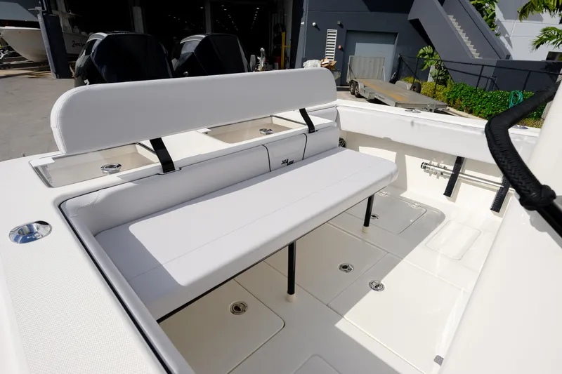 Seavee Yacht Photos Pics 2023 SeaVee 290B boat with white seating and dual outboard motors.