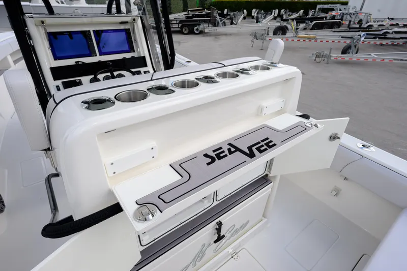 Seavee Yacht Photos Pics 2023 SeaVee 290B boat console with cup holders and storage compartments.