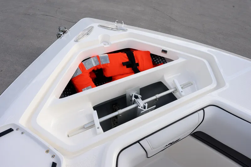 Seavee Yacht Photos Pics 2023 SeaVee 290B boat storage compartment with life jacket and anchor.