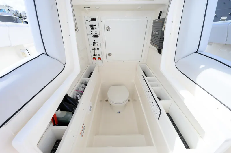 Seavee Yacht Photos Pics 2023 SeaVee 290B boat interior with toilet and storage compartments.