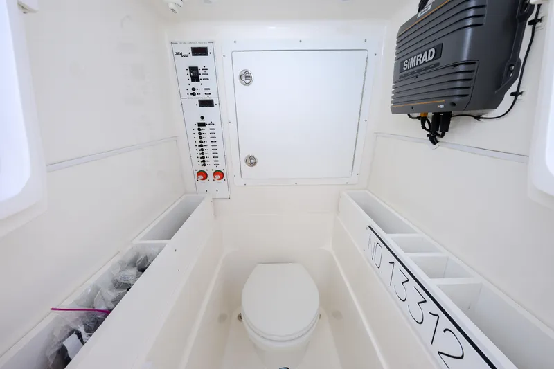 Seavee Yacht Photos Pics 2023 SeaVee 290B boat interior with control panel and Simrad equipment.
