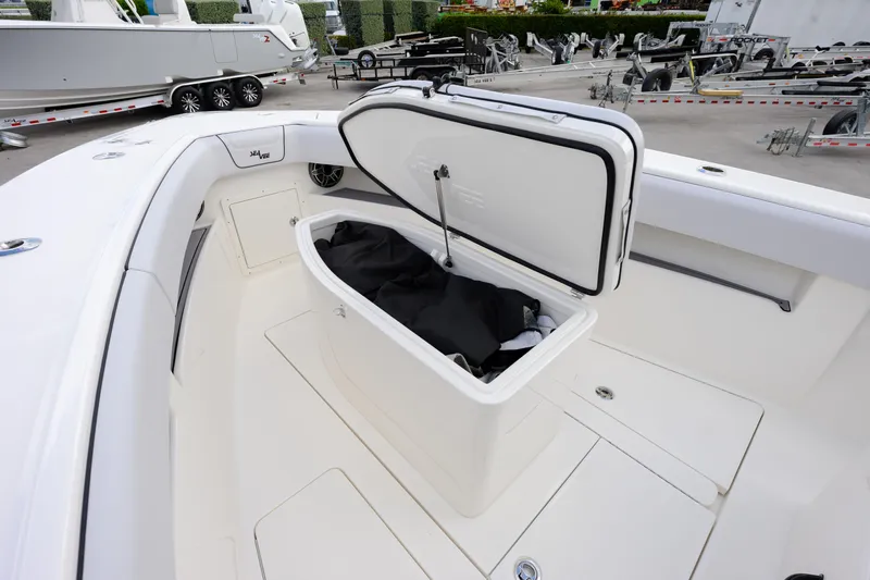 Seavee Yacht Photos Pics 2023 SeaVee 290B boat with open storage compartment on deck.