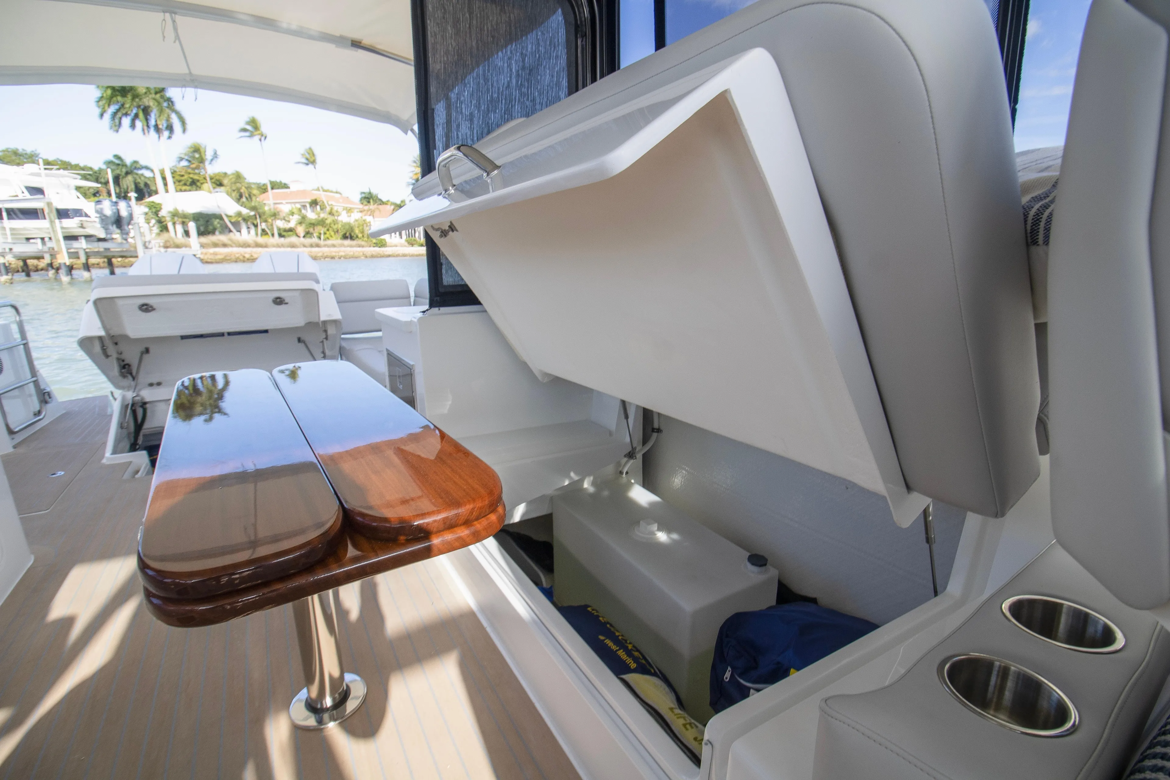 Yacht Photos Pics Interior of 2025 MJM 38 X boat with storage and wooden table.