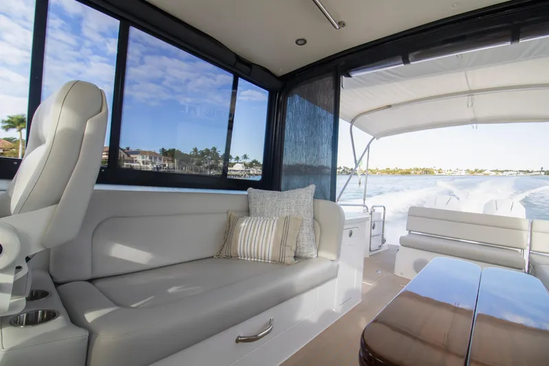  Yacht Photos Pics Luxurious interior of 2025 MJM 38 X yacht with plush seating and scenic water view.