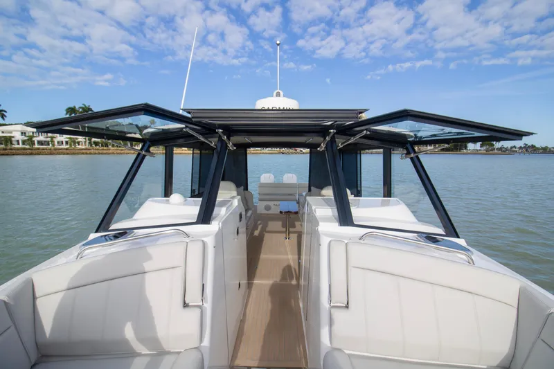  Yacht Photos Pics 2025 MJM 38 X luxury boat with open cockpit and scenic water view.