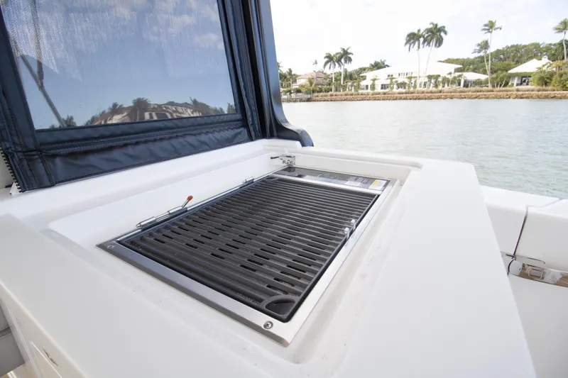  Yacht Photos Pics Outdoor grill on 2025 MJM 38 X yacht, with scenic waterfront view.