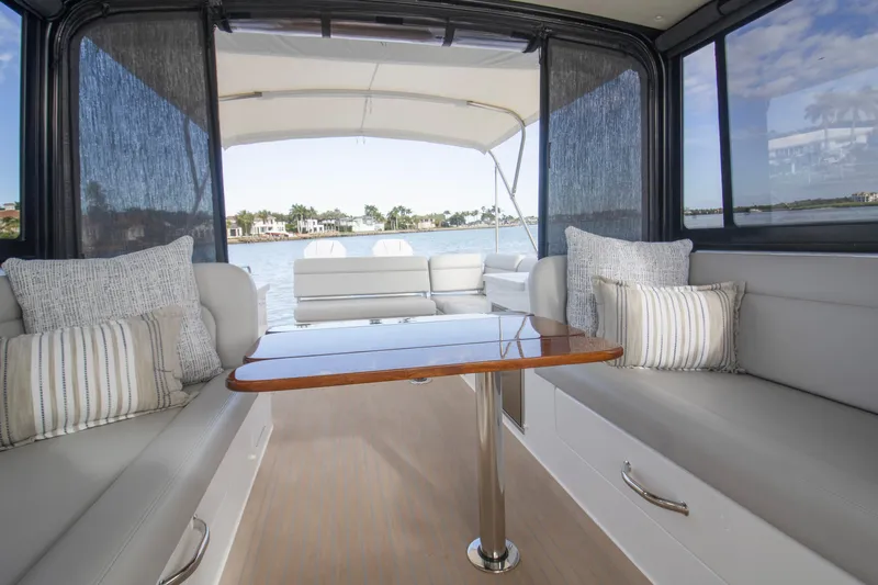  Yacht Photos Pics Luxurious interior of 2025 MJM 38 X yacht with elegant seating and scenic water view.
