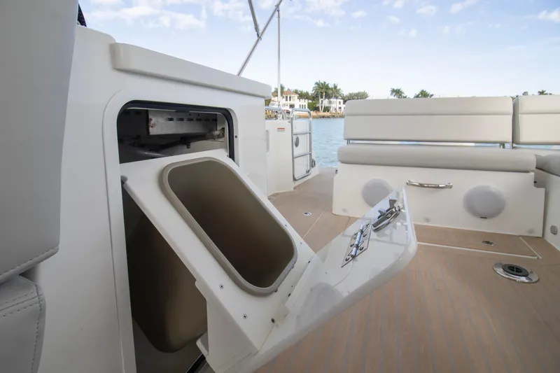  Yacht Photos Pics 2025 MJM 38 X boat interior with open storage compartment and seating area.