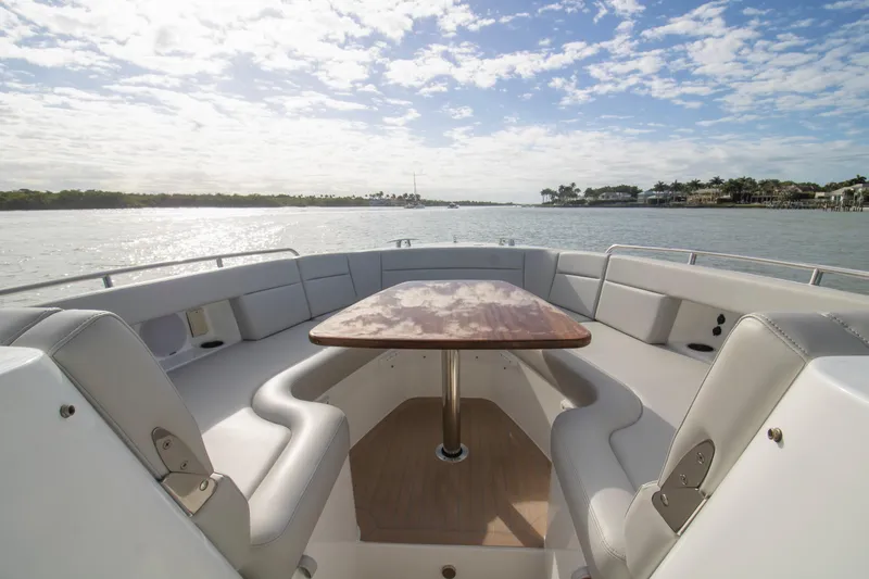  Yacht Photos Pics Luxury seating area on 2025 MJM 38 X boat, with scenic water view.
